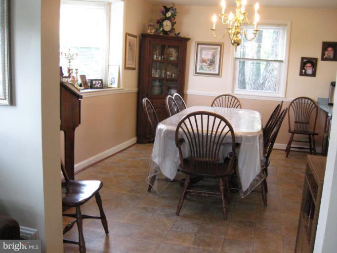 6900 Fieldcrest Road Baltimore, MD 21215 - Photo 14 of 15 a view of a livingroom with furniture and windows