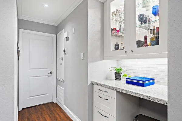 a bathroom with a sink mirror and vanity
