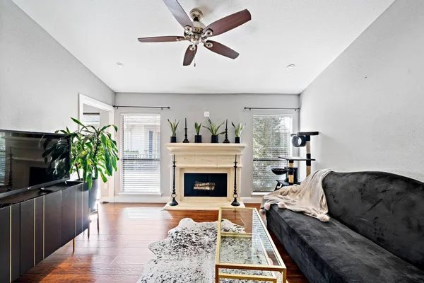 a living room with furniture and a fireplace