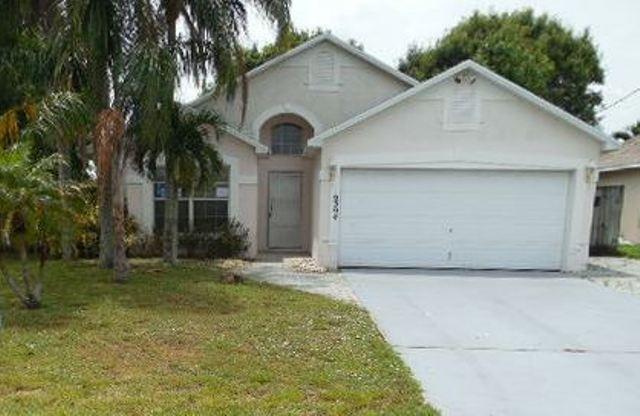 6394 Pompano Street Jupiter, FL 33458 - Photo 1 of 10 Front