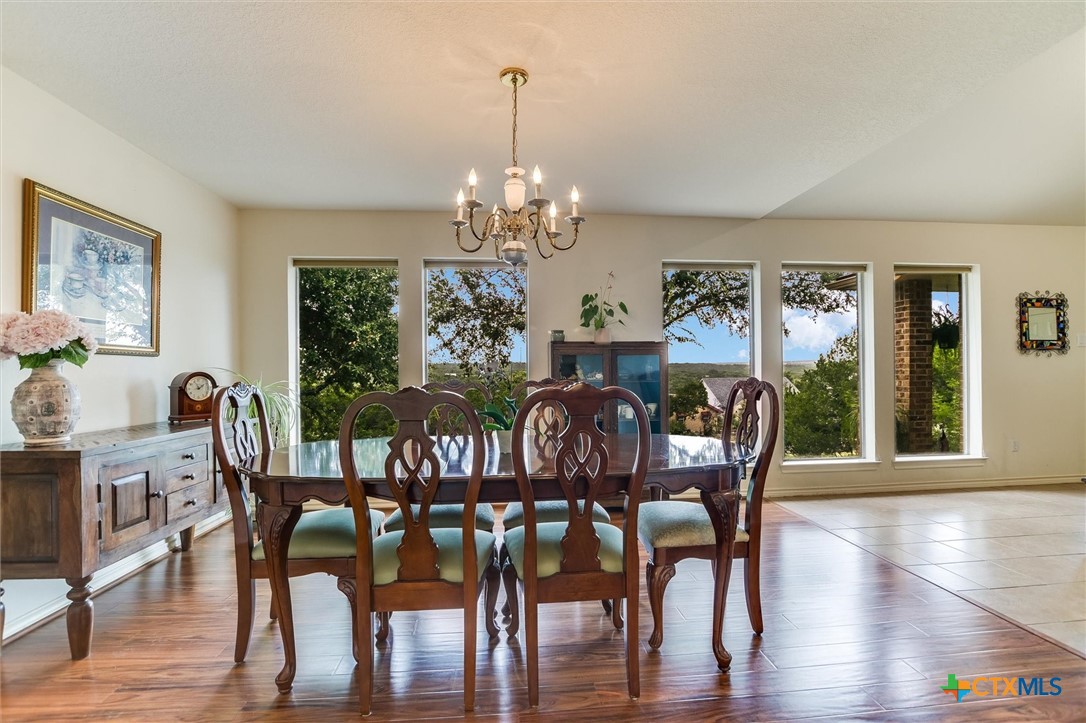 60 Crazy Cross Road Wimberley, TX 78676 - Photo 6 of 20 Dining space illuminated by abundant natural lighting and views.