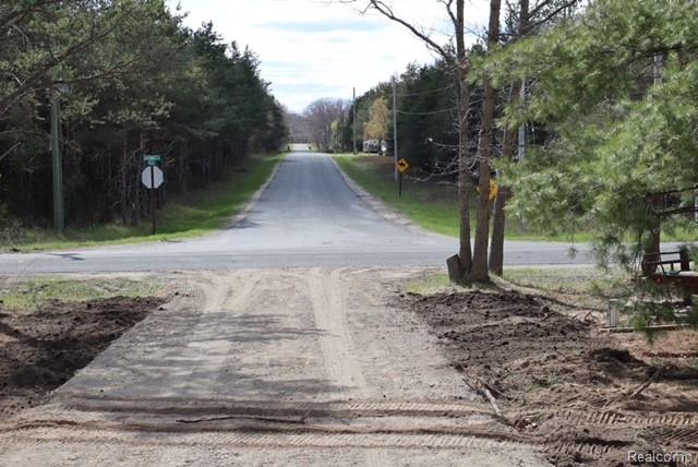 1545 South La Chance Road Lake City, MI 49651 - Photo 6 of 51 View of dirt / gravel road with traffic signs