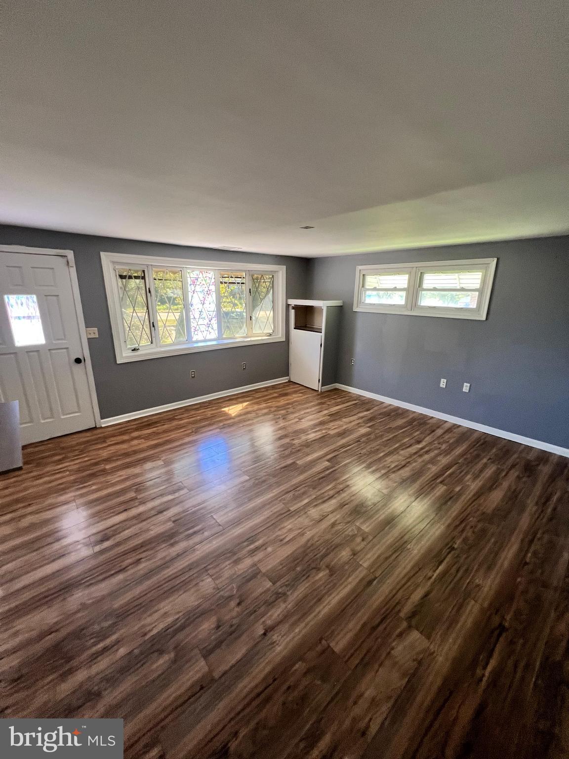 4440 Annapolis Road Halethorpe, MD 21227 - Photo 17 of 37 a view of an empty room with window and wooden floor
