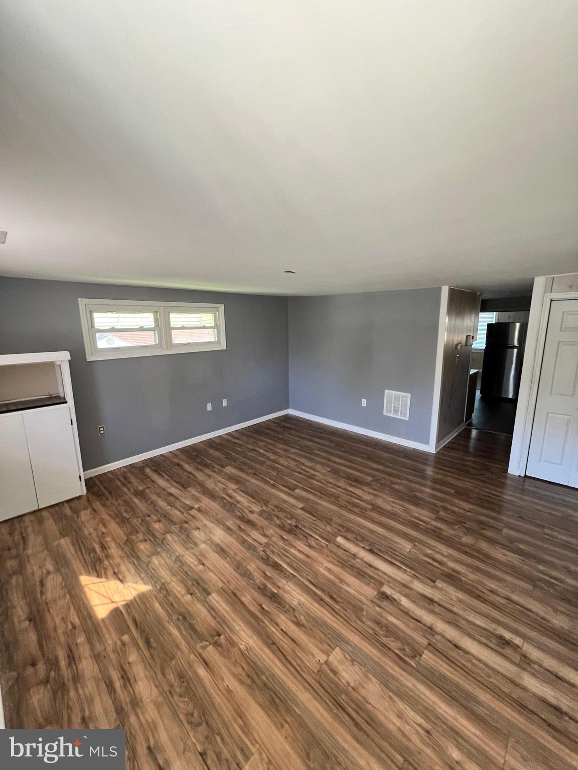 4440 Annapolis Road Halethorpe, MD 21227 - Photo 18 of 37 a view of empty room with window and wooden floor