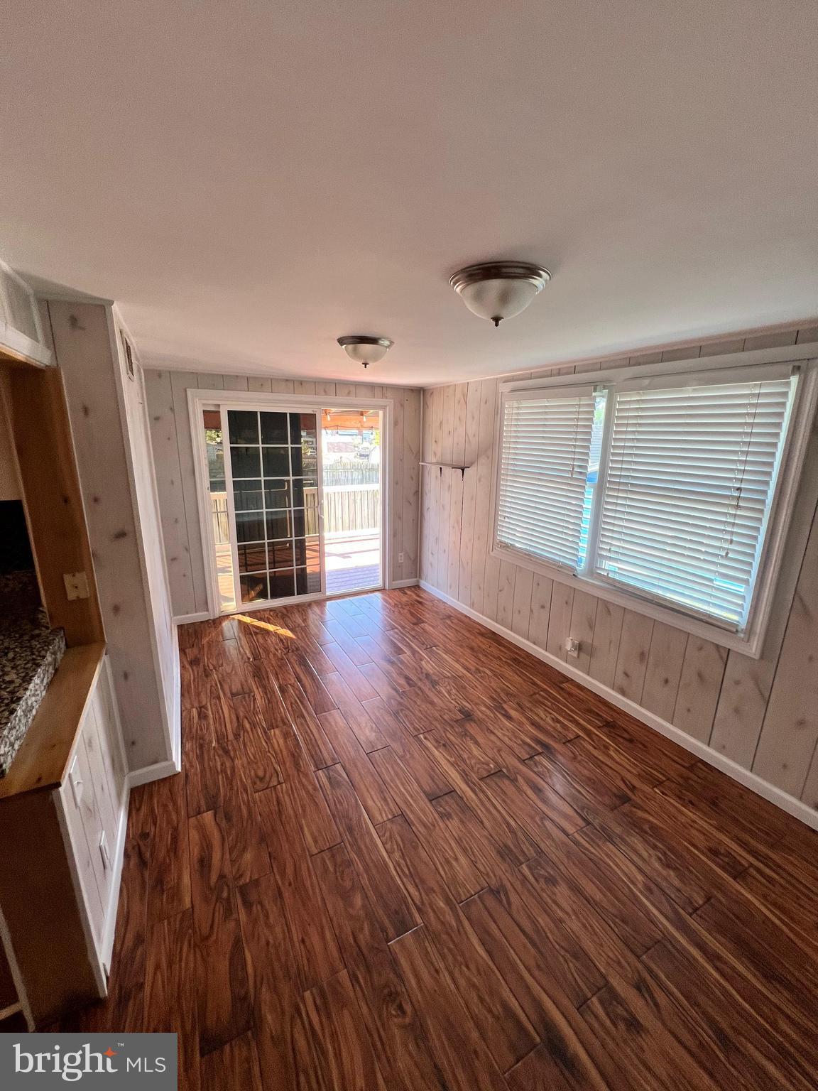 4440 Annapolis Road Halethorpe, MD 21227 - Photo 24 of 37 wooden floor in an empty room with a window
