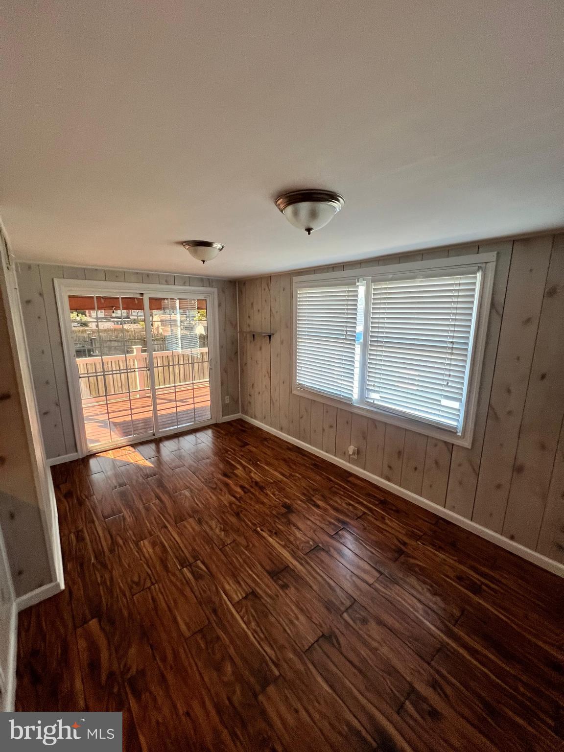 4440 Annapolis Road Halethorpe, MD 21227 - Photo 25 of 37 a view of an empty room with wooden floor and a window