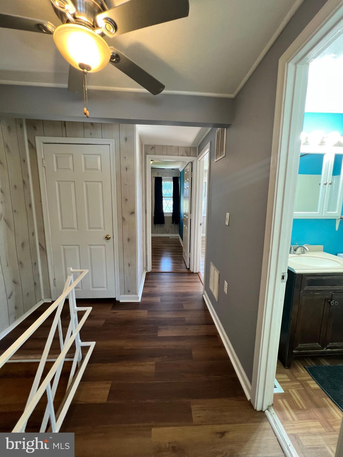 4440 Annapolis Road Halethorpe, MD 21227 - Photo 27 of 37 a view of a hallway with wooden floor and staircase