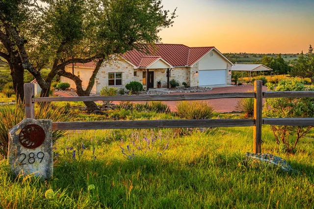 a house with swimming pool in front of it