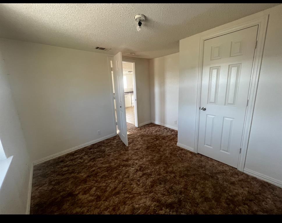 3133 Tbd County Road Lone Oak, TX 75453 - Photo 4 of 21 Interior room featuring plush brown carpeting, white walls, and white trim