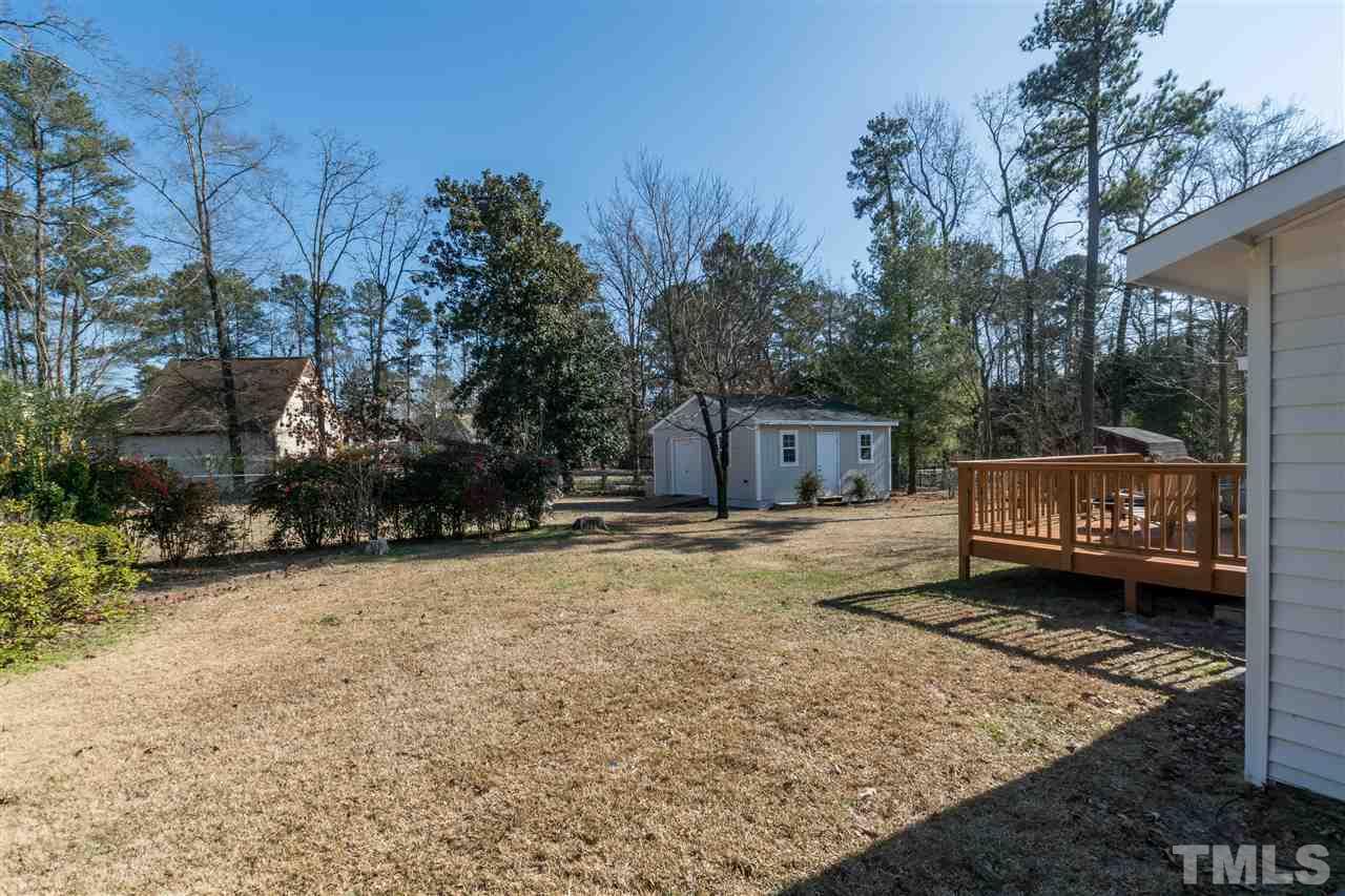 3218 Jupiter Street Raleigh, NC 27604 - Photo 22 of 24 a view of a house with backyard and trees