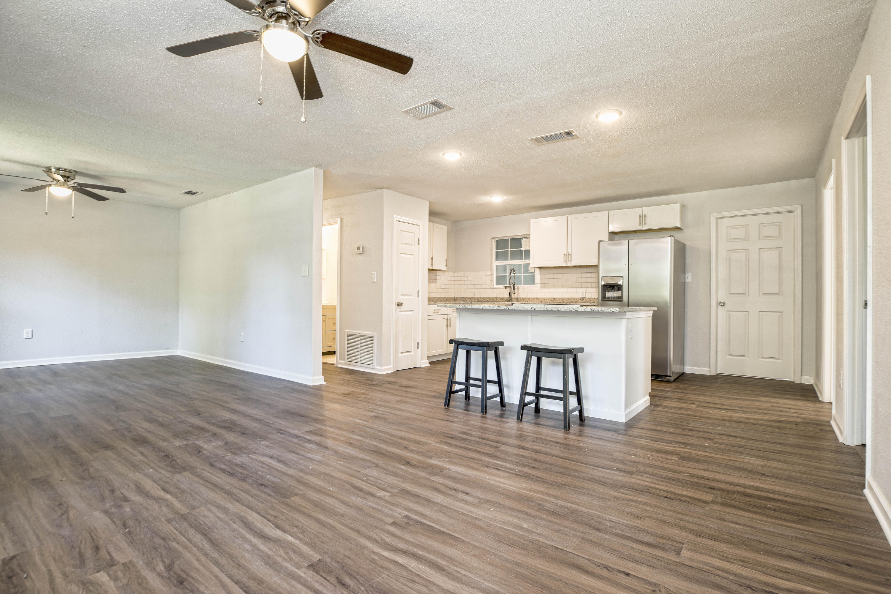 695 Ridge Lake Road Crestview, FL 32536 - Photo 11 of 27 a view of kitchen with refrigerator microwave and stove