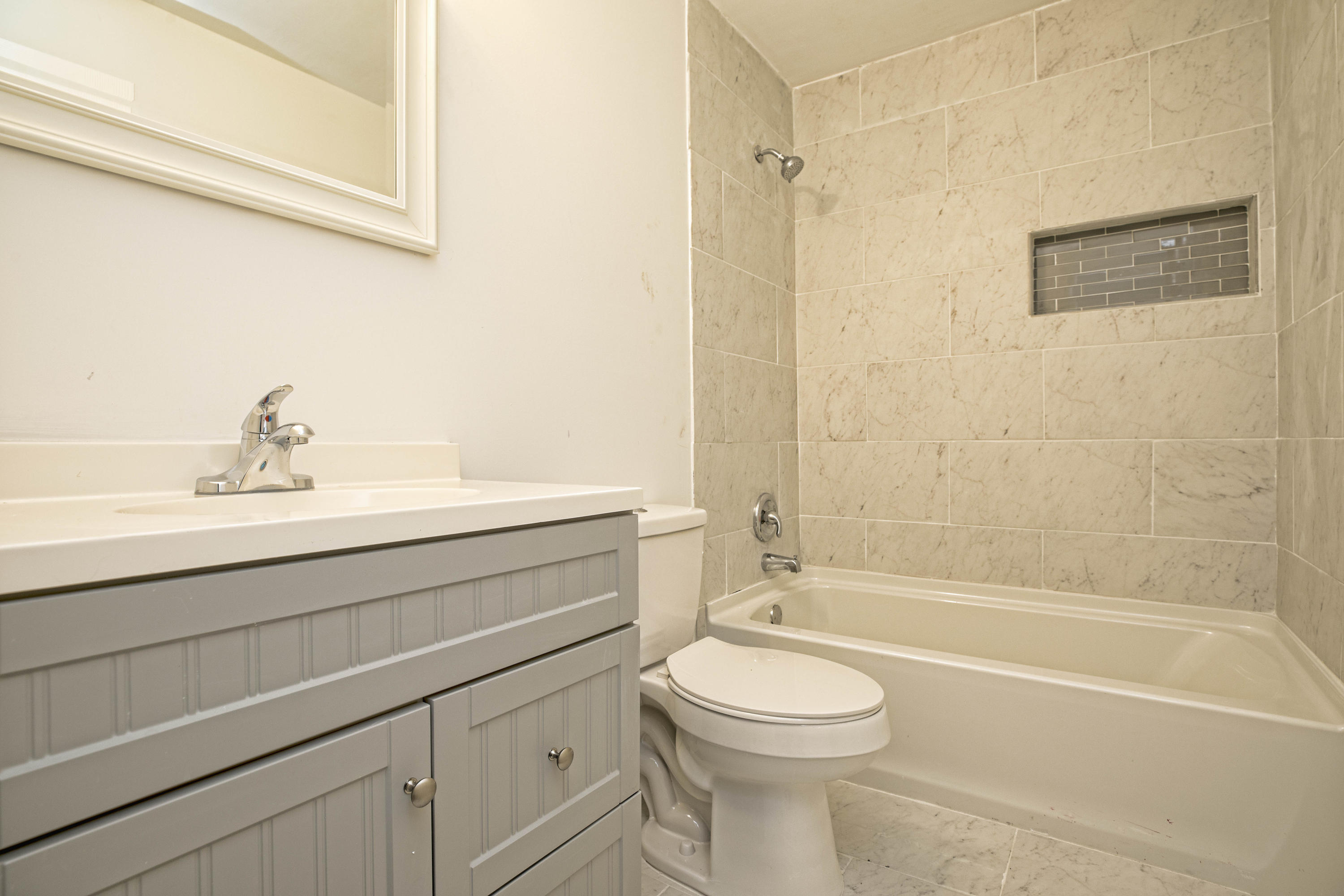 695 Ridge Lake Road Crestview, FL 32536 - Photo 16 of 27 a bathroom with a sink a toilet and shower
