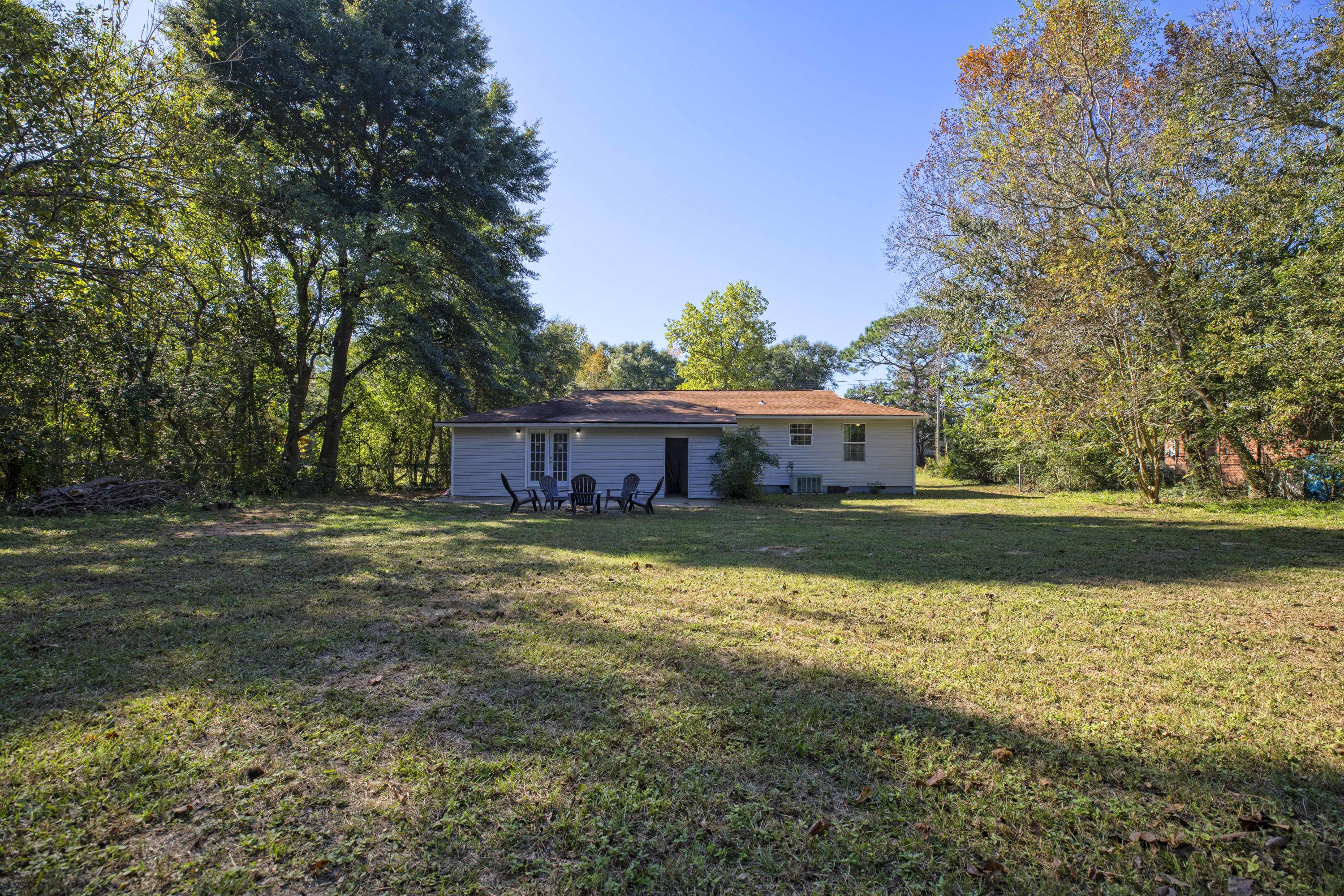 695 Ridge Lake Road Crestview, FL 32536 - Photo 23 of 27 a view of a house with a yard