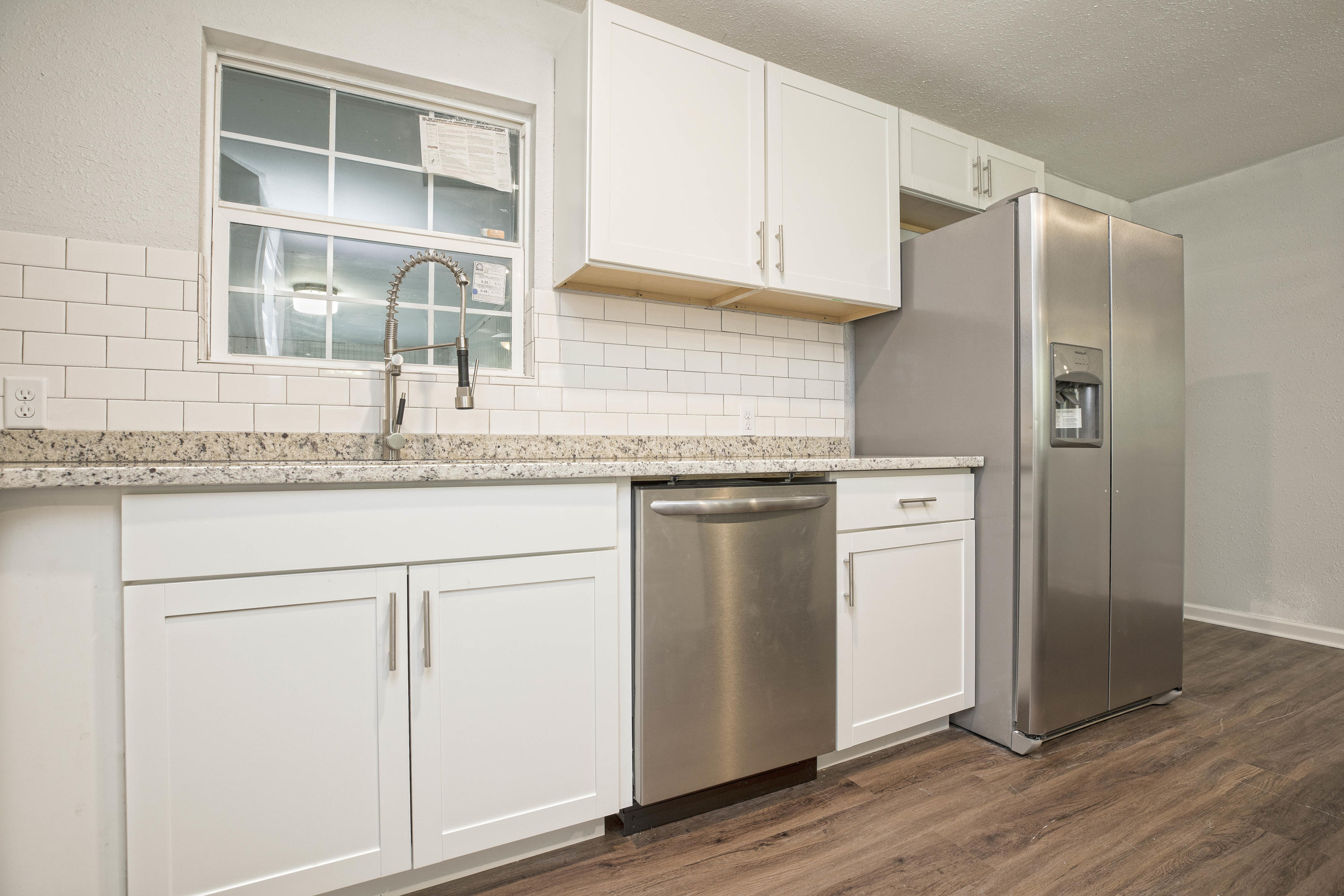 695 Ridge Lake Road Crestview, FL 32536 - Photo 8 of 27 a kitchen with granite countertop cabinets and window