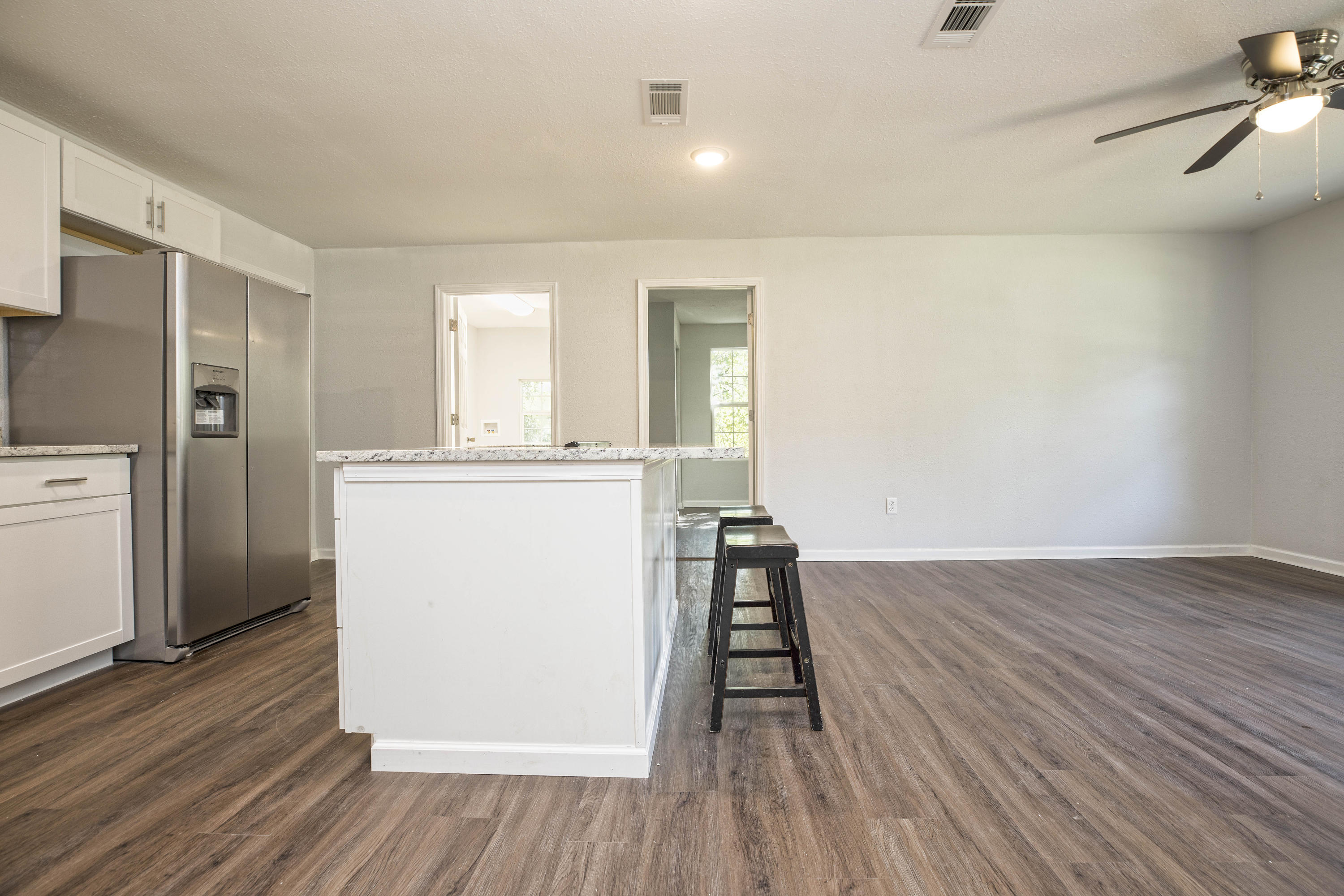 695 Ridge Lake Road Crestview, FL 32536 - Photo 10 of 27 wooden floor in an empty room with wooden floor