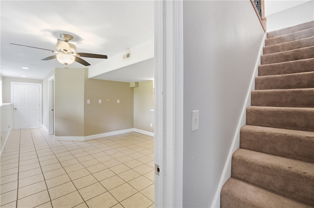1208 Jarva Lane Springboro, OH 45066 - Photo 52 of 75 This interior image showcases an inviting living area with a staircase, offering versatile layout possibilities.