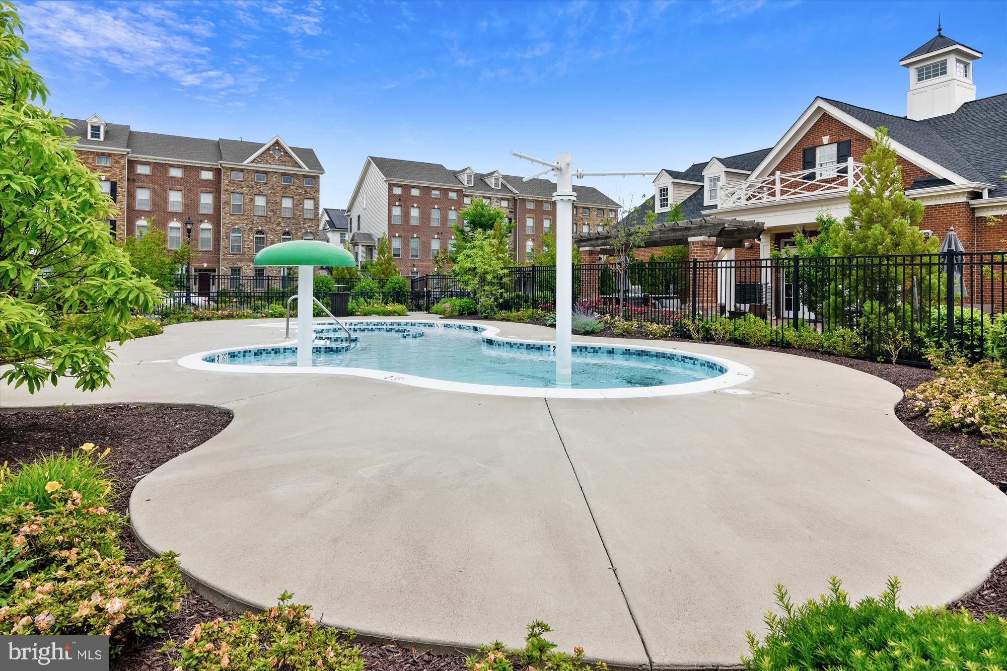 43341 Goshen Run Square Ashburn, VA 20148 - Photo 24 of 29 a front view of a house with a garden and plants