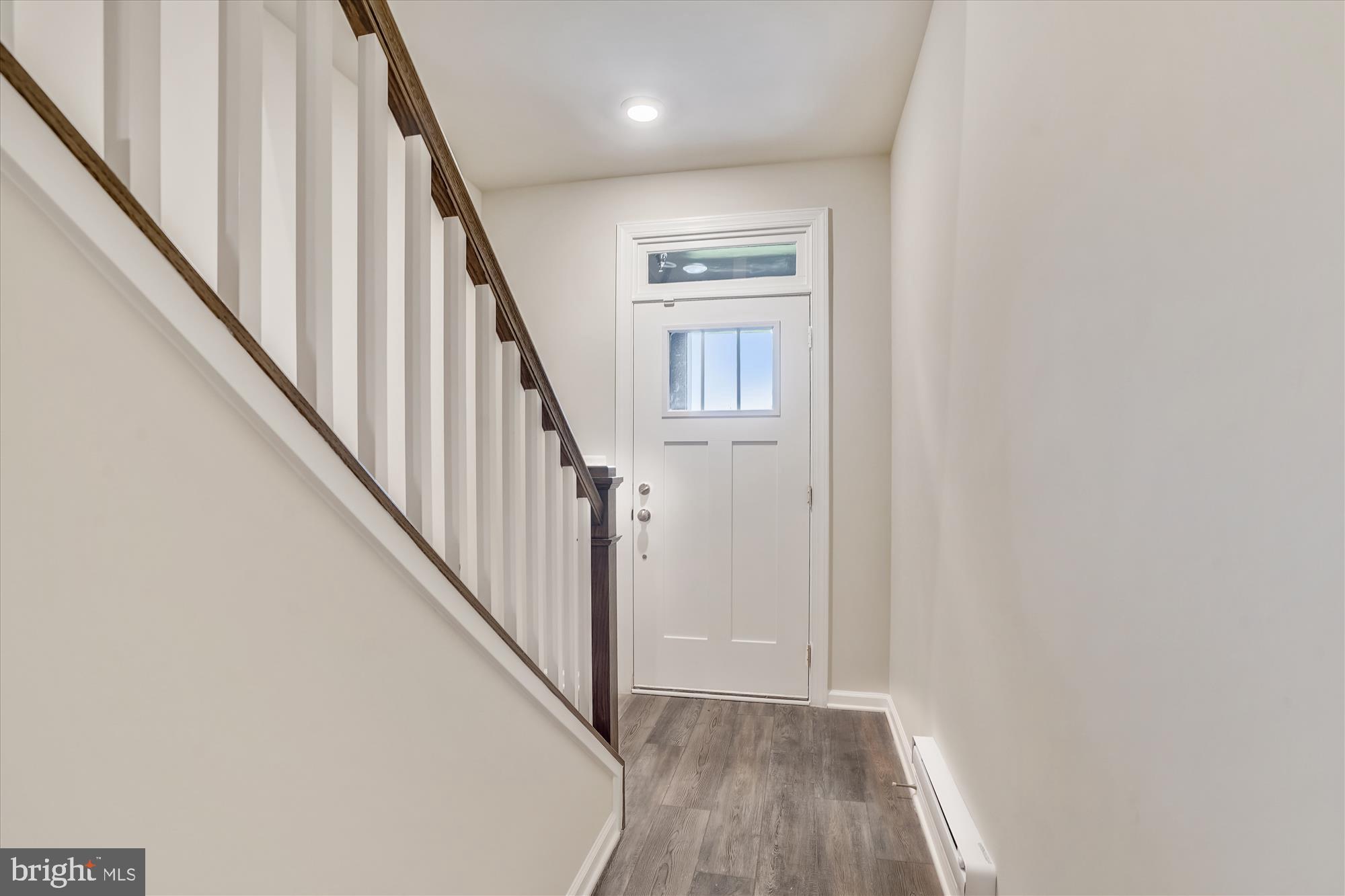 43341 Goshen Run Square Ashburn, VA 20148 - Photo 3 of 29 a view of a hallway with wooden floor and entryway