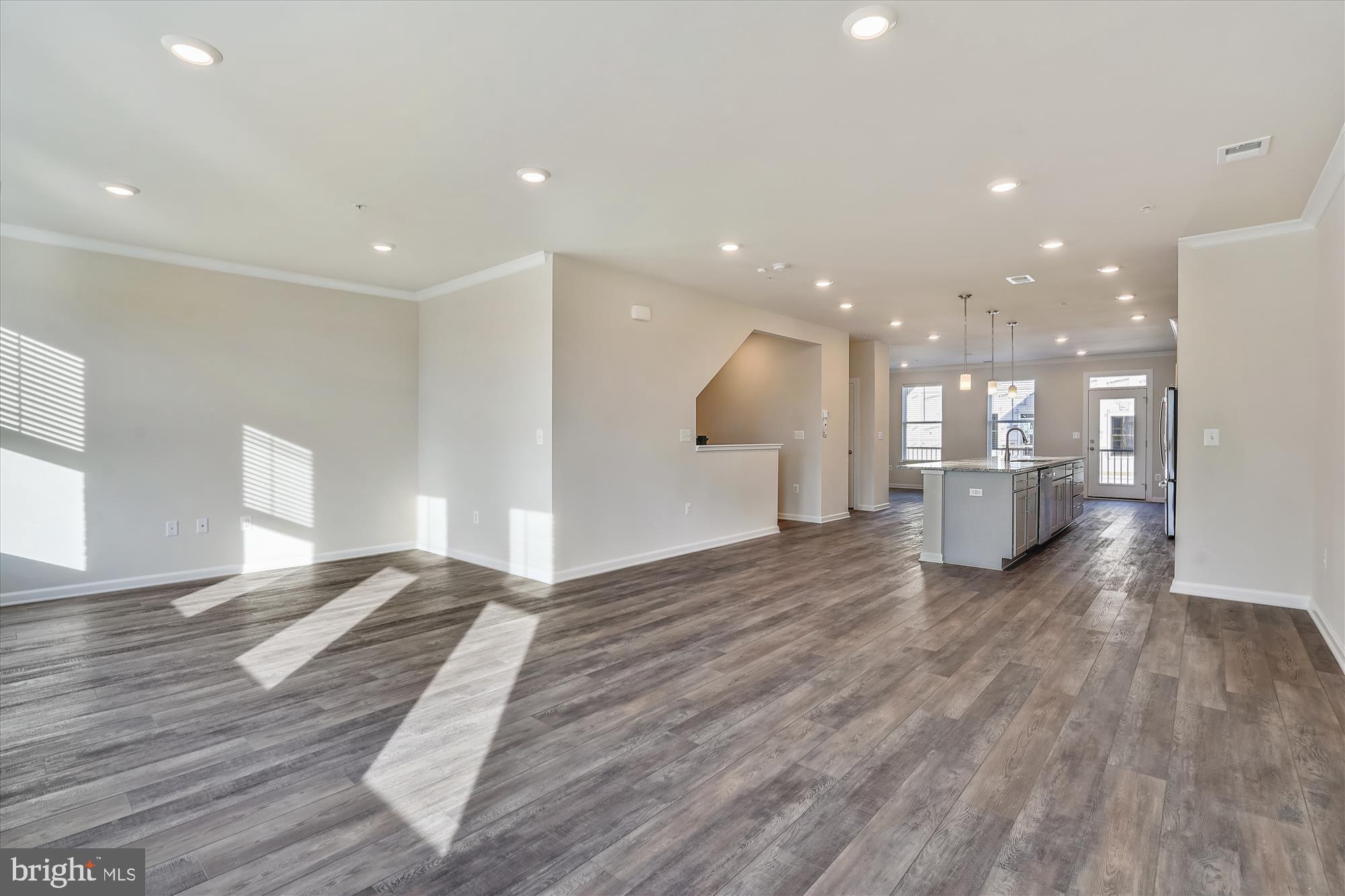 43341 Goshen Run Square Ashburn, VA 20148 - Photo 7 of 29 a view of a kitchen with a sink and wooden floor