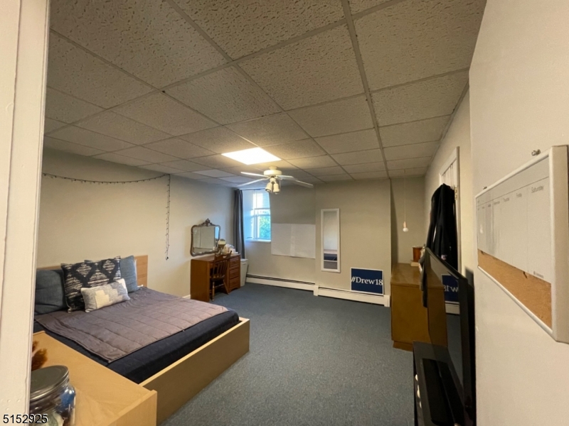 17 Waverly Place, Unit 9 Madison, NJ 07940 - Photo 12 of 15 a room with furniture and gym equipment