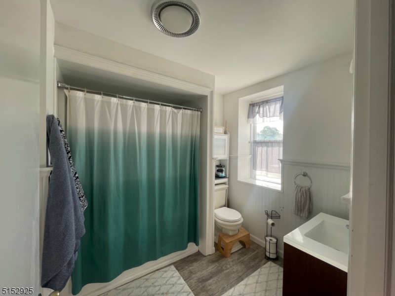 17 Waverly Place, Unit 9 Madison, NJ 07940 - Photo 8 of 15 a spacious bathroom with a toilet sink and shower