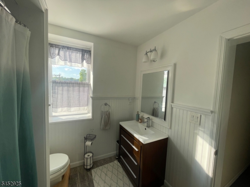 17 Waverly Place, Unit 9 Madison, NJ 07940 - Photo 9 of 15 a bathroom with a sink vanity granite and toilet