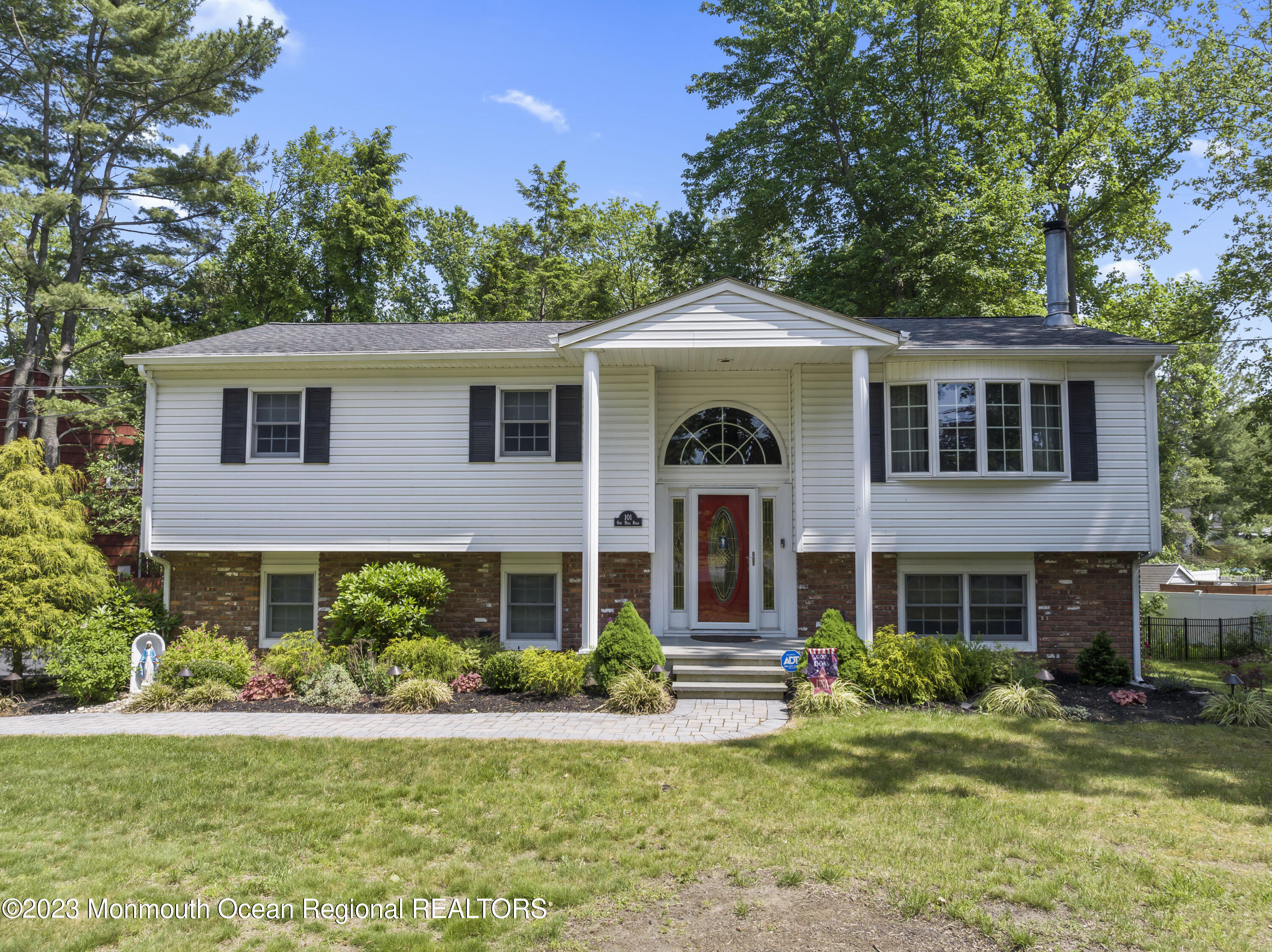 a front view of a house with a yard