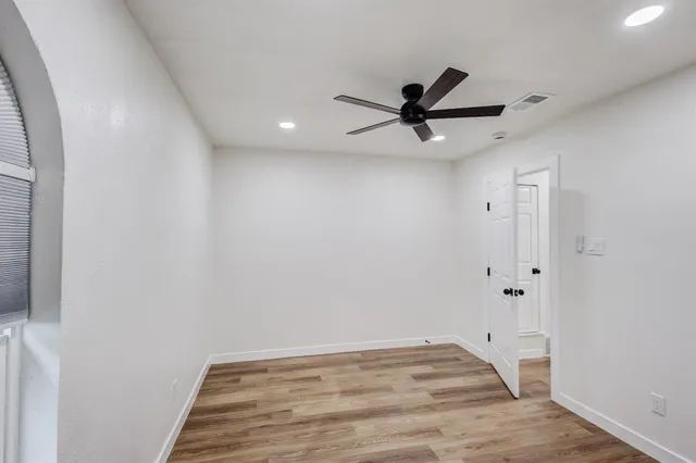 a view of a ceiling fan with wooden floor