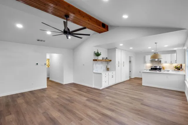 a view of kitchen and kitchen with wooden floor