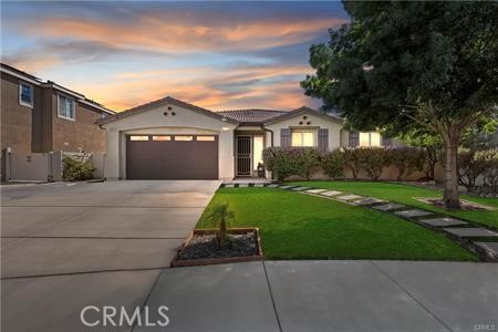 39366 11th Street West Palmdale, CA 93551 - Photo 1 of 15 a front view of a house with a garden and trees