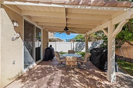 39366 11th Street West Palmdale, CA 93551 - Photo 5 of 15 a view of a patio with table and chairs and potted plants