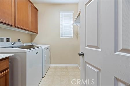 39366 11th Street West Palmdale, CA 93551 - Photo 9 of 15 a utility room with dryer and washer
