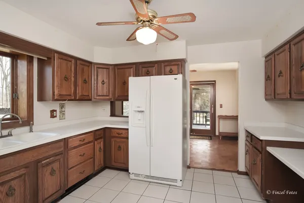 a kitchen with a refrigerator a sink and dishwasher