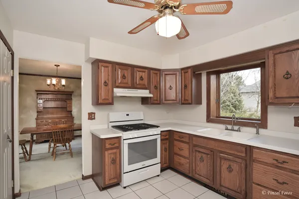 a kitchen with stainless steel appliances a stove sink and cabinets