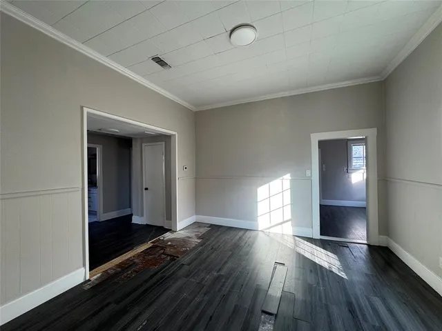 a kitchen with sink stove and cabinets