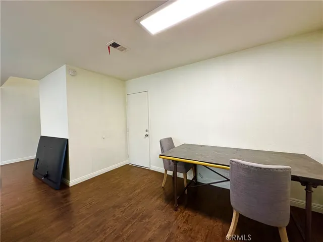 a workspace with furniture and wooden floor