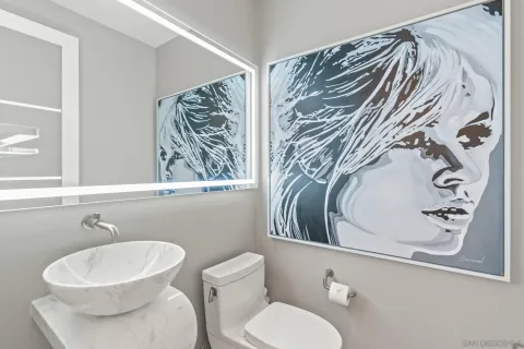 a bathroom with a toilet and a sink