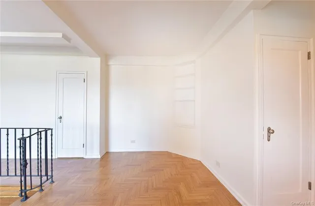 a bedroom with a large bed and a flat screen tv
