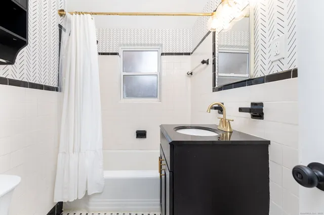 a bathroom with a sink and mirror