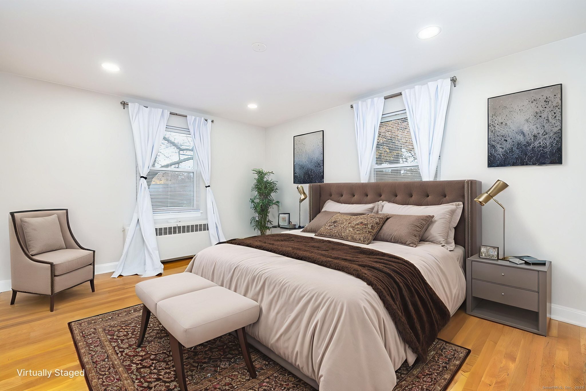 43 Arnold Way, Unit 43 West Hartford, CT 06119 - Photo 14 of 21 a bedroom with a bed and wooden floor