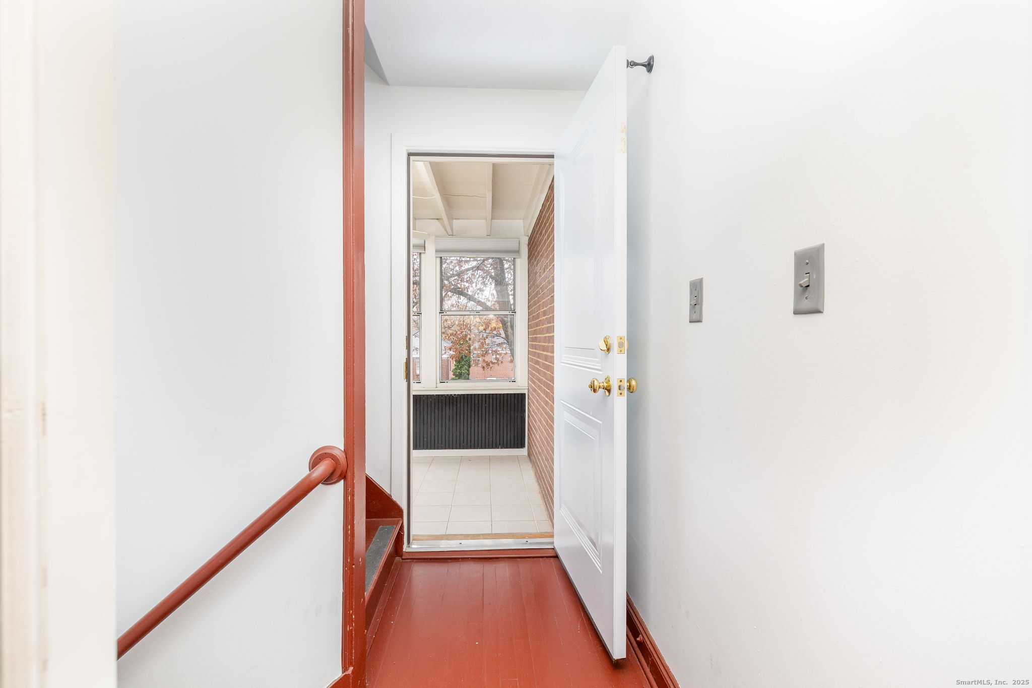 43 Arnold Way, Unit 43 West Hartford, CT 06119 - Photo 16 of 21 a view of a hallway with wooden floor and staircase