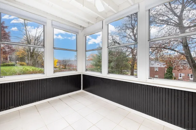 a view of a balcony with wooden floor