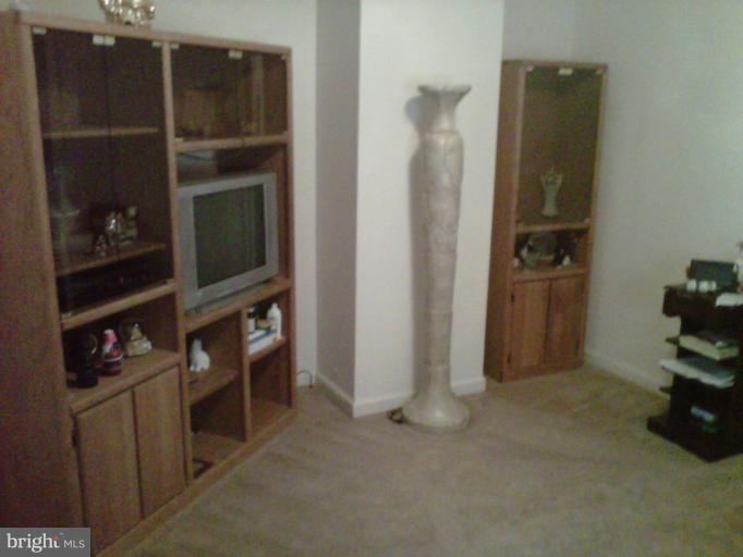 304 South Buchannan Street, Unit A B Ranson, WV 25438 - Photo 2 of 9 a view of an empty room with closet and a window