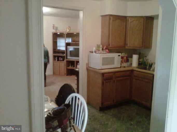 304 South Buchannan Street, Unit A B Ranson, WV 25438 - Photo 5 of 9 a view of cabinets and wooden floor