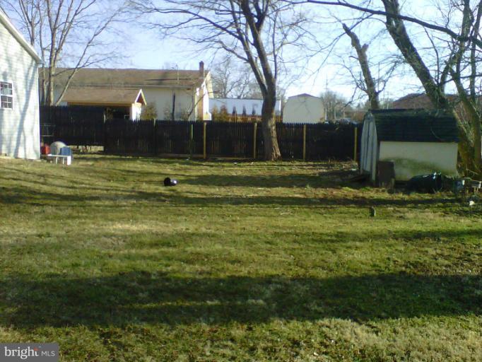 304 South Buchannan Street, Unit A B Ranson, WV 25438 - Photo 8 of 9 a view of a house with a yard
