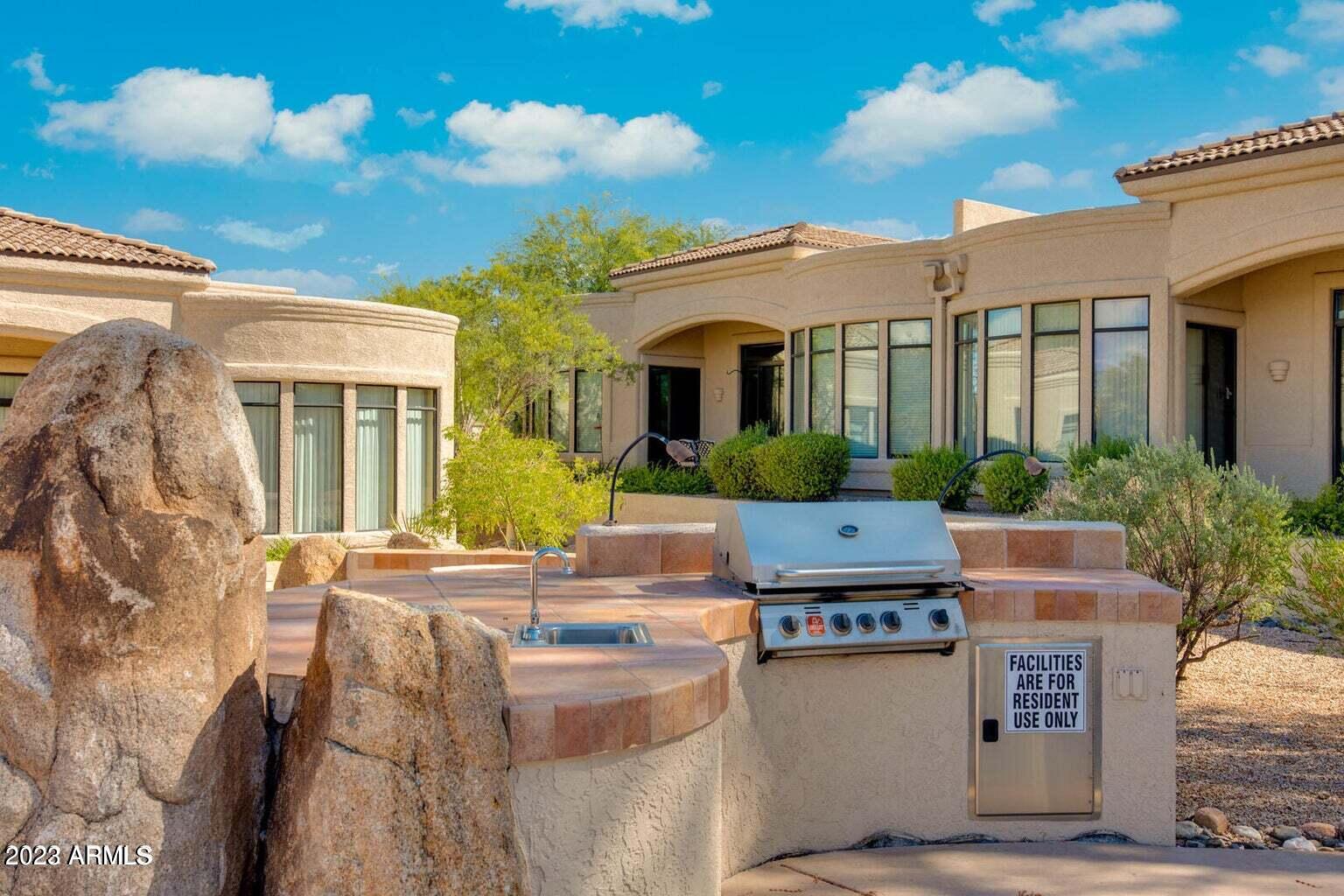 25603 North Sago Drive Rio Verde, AZ 85263 - Photo 16 of 25 a view of house with outdoor space and swimming pool