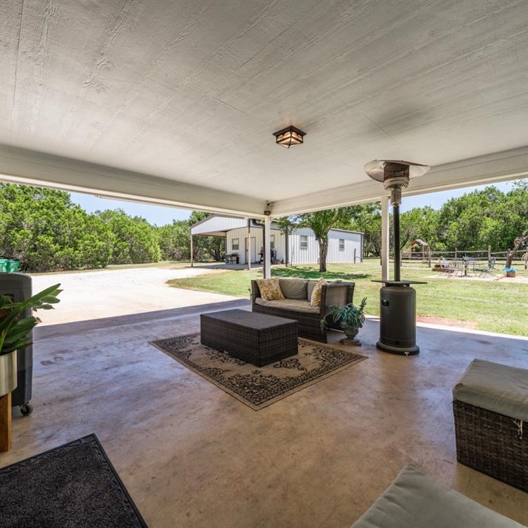 785 Tweedy Road Valley Mills, TX 76689 - Photo 34 of 40 Spacious covered patio with concrete flooring and overhead lighting
