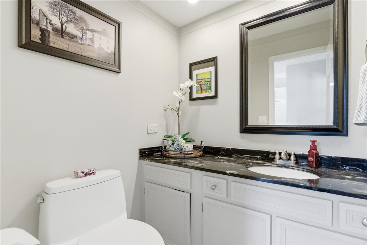 12 Crestview Lane Lake Barrington, IL 60010 - Photo 15 of 54 a bathroom with a toilet a sink and mirror