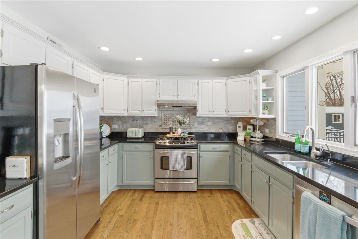 12 Crestview Lane Lake Barrington, IL 60010 - Photo 18 of 54 a kitchen with a sink a refrigerator and window