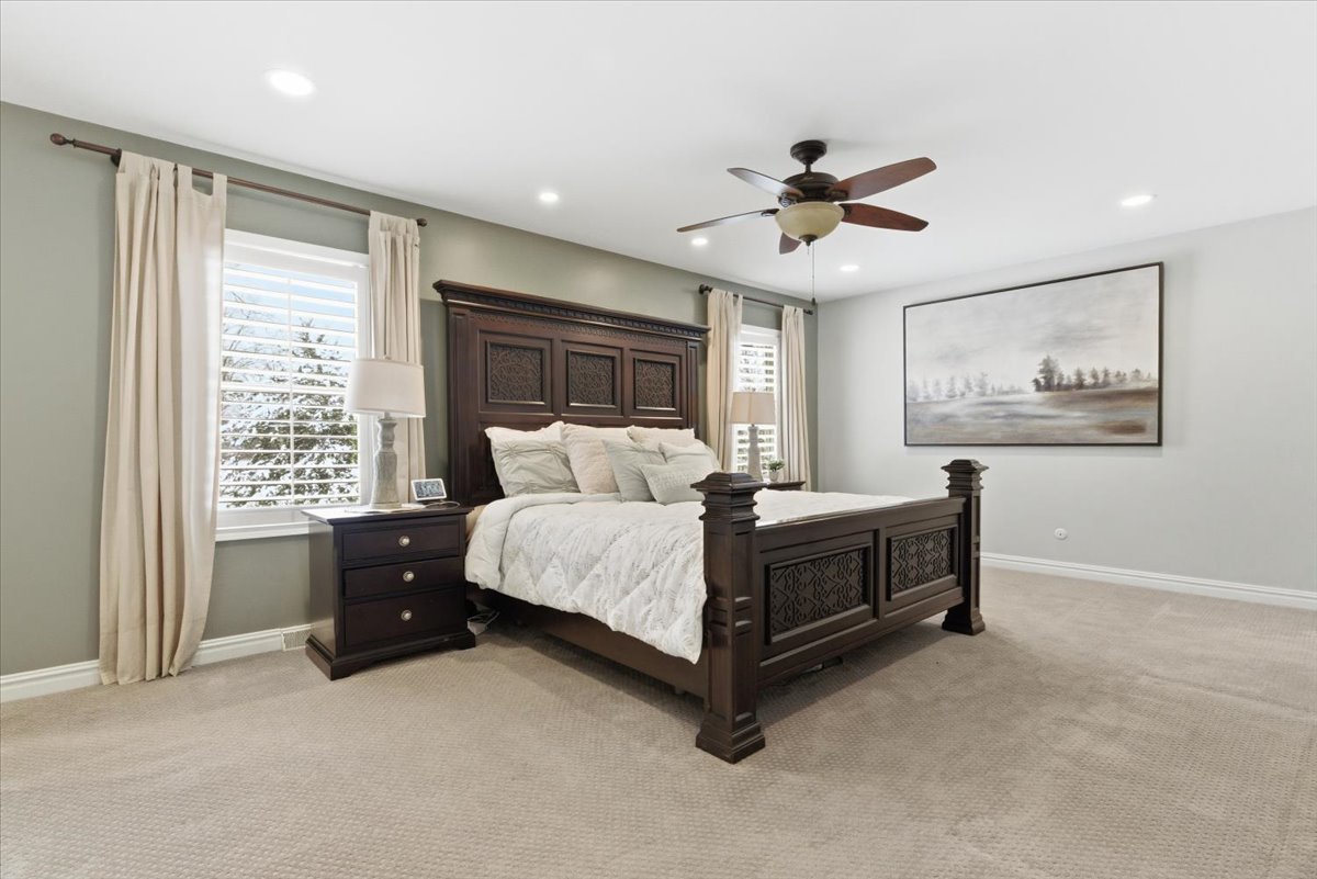 12 Crestview Lane Lake Barrington, IL 60010 - Photo 21 of 54 a spacious bedroom with a bed and a window